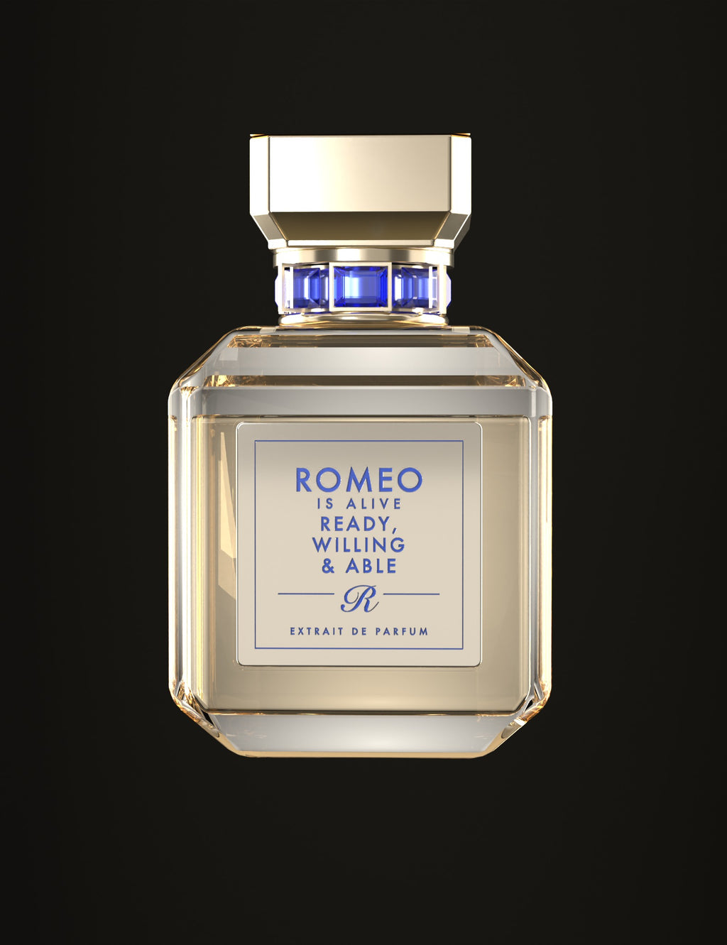 Ready, Willing & Able, extrait de parfum Romeo is Alive : flacon en verre transparent, jus champagne clair, bouchon doré, bague sertie de pierres bleues et plaque dorée gravée en bleu